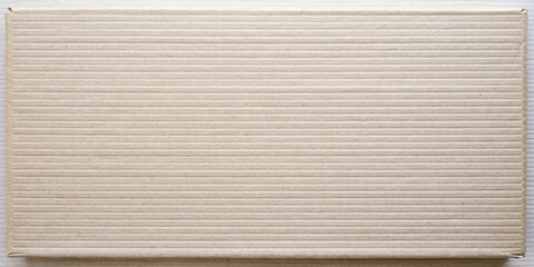 Obraz premium Close-up Macro View of a Smooth Cardboard Surface with Horizontal Ridges Showing the Detailed Texture and Subtle Variations in Color