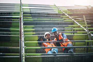 Tablet, man and woman on construction scaffolding with plan, collaboration and architecture....