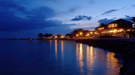 Fototapeta premium Breathtaking view of a serene sea shore resort, featuring pristine sandy beaches, crystal-clear turquoise waters, and luxurious cabanas lining the shore. This idyllic getaway showcases palm trees sway