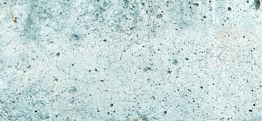 Obraz premium Close-up image showcasing the textured surface of a light blue concrete wall. Premium classic wall background photo for banner background or wallpaper.