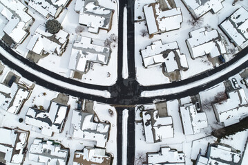 Aerial View of Snow-Covered Suburban Neighborhood in Winter