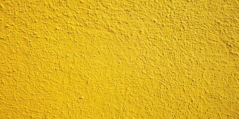 Texture and background of yellow concrete wall with shallow depth of field