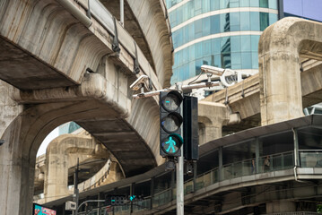 Close-up of city pedestrian traffic light green color man symbol. Outdoor surveillance enforcement...