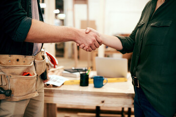 Carpenter, handshake and workshop with agreement, greeting and small business with people....