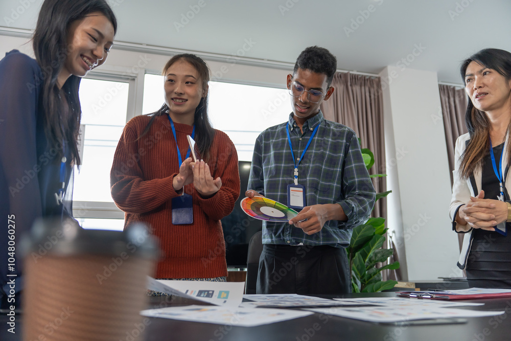 Wall mural group of software engineers design ux/ui for applications on smartphone/laptop