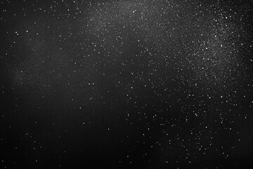 Obraz premium High-Resolution Black Background Texture with White Speckles for Vintage Film Effect and Retro Overlay Designs 