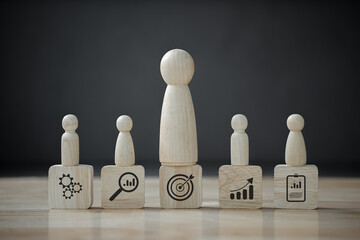 wooden doll that Different and standing with TEAM. concept for leadership and team leader.
