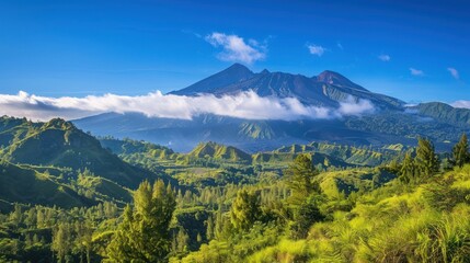 Obraz premium Lush Green Hills and a Majestic Volcanic Peak under a Clear Blue Sky