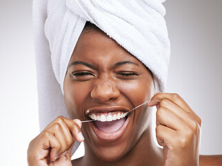 Happy, black woman and portrait with dental floss for teeth cleaning, hygiene or gum care on a...