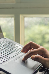 person typing on a laptop computer