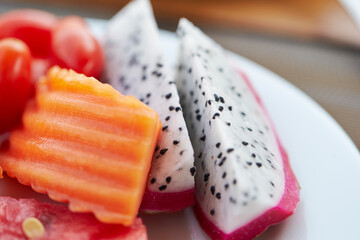 Dragon fruit and tropical fruits on a plate