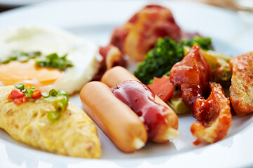 Omelette, rice and vegetables on a plate