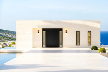 Modern minimalistic villa with ocean views in serene coastal setting