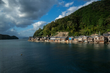 Fototapeta premium Funaya Boathouses in Ine fisherman village Kyoto Prefecture, The funayas were originally constructed to lift fishermen's wooden boats from the sea