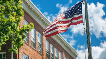 Fototapeta premium American Flag Waving in Front of Brick Building