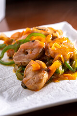 Fish with vegetables in sweet and sour sauce on white background. Food concept. Chinese food