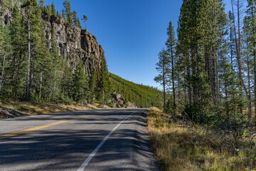 Obsidian Cliff, Yellowstone National Park , Wyoming.  Obsidian is a naturally occurring volcanic glass formed when lava extruded from a volcano cools rapidly with minimal crystal growth.  igneous rock