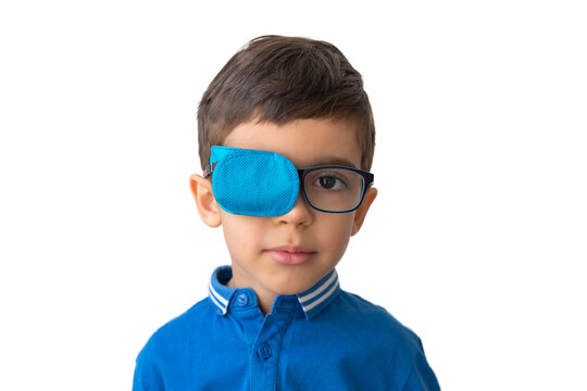 Boy in glasses with eye patch. Occluder, lazyeye, amblyopia, strabismus. Vision testing concept. Reviewing eyesight