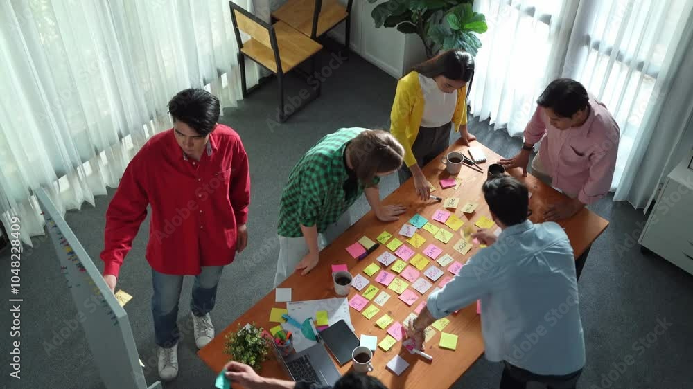 Poster top view of diverse business people writing and stick sticky notes at whiteboard. creative team work