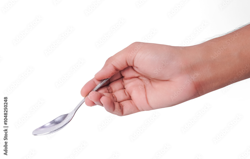 Wall mural male hand holding a silver stainless spoon closeup photo isolated on white background