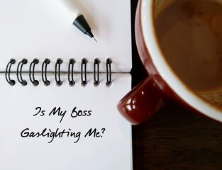 Notebook with handwritten text Is My Boss Gaslighting Me? - employee concerns about gaslighting in...