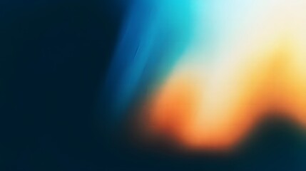 Obraz premium Minimalist Dark Gradient Background in Blue and Orange Tones with Blurred Grain Texture and Soft Light Rays for a Contemporary, Subtle Design Effect