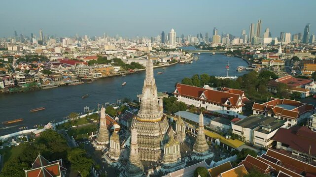 Aeriail view temple of dawn Wat Arun pagoda with Chaophraya river and building Bangkok Thailand
