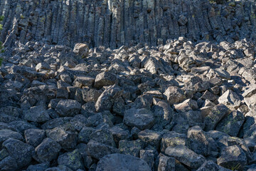 Columnar Jointing in Swan Lake Flat Basalt at Sheepeater Cliff. Gardner River. Yellowstone National Park , Wyoming.  The Sheepeater Cliffs are a series of exposed cliffs made up of columnar basalt 
