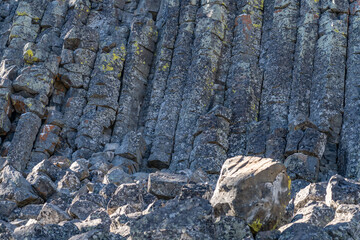 Columnar Jointing in Swan Lake Flat Basalt at Sheepeater Cliff. Gardner River. Yellowstone National Park , Wyoming.  The Sheepeater Cliffs are a series of exposed cliffs made up of columnar basalt 