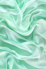Obraz premium Elegant silky mint fabric texture with soft, flowing waves and delicate light play.