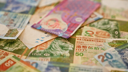 Colorful hong kong dollar banknotes scattered creating a vibrant display of the local currency from...