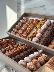 Different types of bread in baskets nicely arranged.