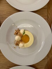 Yellow cake nicely decorated on a white plate.