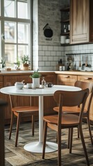 Obraz premium Cozy kitchen dining setup with wooden cabinets and round table near window in a sunlit room