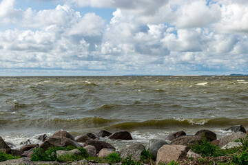 seascape, sea during a storm, splashing waves and fast moving clouds, Cape Vente near the Curonian Spit in Lithuania