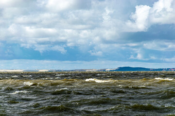 Fototapeta premium seascape, sea during a storm, splashing waves and fast moving clouds, Cape Vente near the Curonian Spit in Lithuania