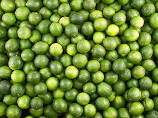 Pile of lime fruits at supermarket 