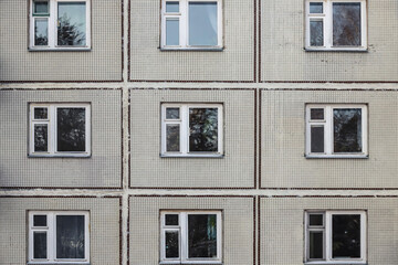 Obraz premium The old gray panel house. Texture and background 