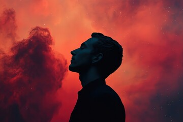 Man Silhouetted Against Red Sky with Stars
