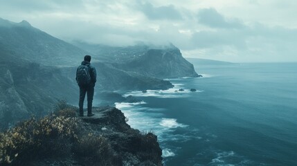 Solitary Hiker Gazing at the Rugged Coastal Landscape