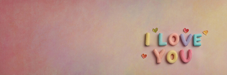 Obraz premium Romantic 'I LOVE YOU' Text in Soft Pastel Colors with Heart Accents