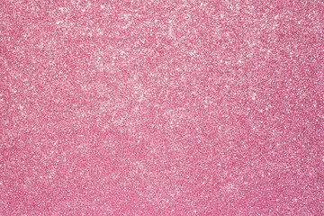 Fototapeta premium vibrant pink glitter background that adds touch of sparkle and glamour to any design. Perfect for festive occasions or creative projects