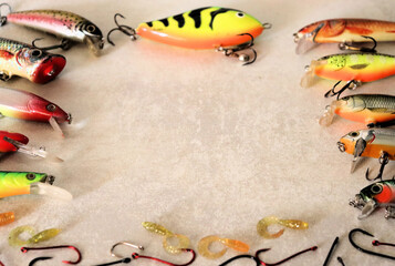 Banner of fishing lures for catching predatory fish, on a wooden background