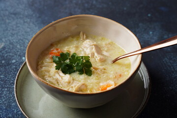 Avgolemono - traditional greek chicken soup with rice, lemon and eggs, traditional greek chicken