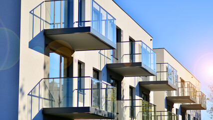Naklejka premium Modern multifamily building in a european city. Walls made of concrete. Luxury house complex.