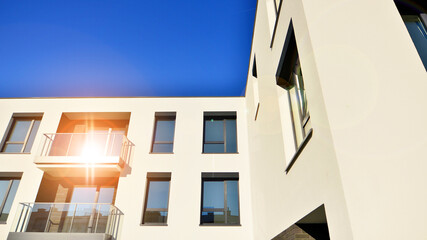 Modern multifamily building in a european city.  Walls made of concrete. Luxury house complex.