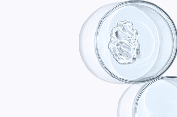 Skin serum or face wash gel in a Petri dish. For cosmetic procedures. White background