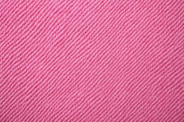 Detailed close-up of pink fabric with a diagonal weave pattern, highlighting texture and color. This image is ideal for backgrounds, textile design, or fashion and craft concepts.