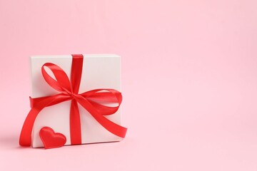 Beautiful gift box on color background