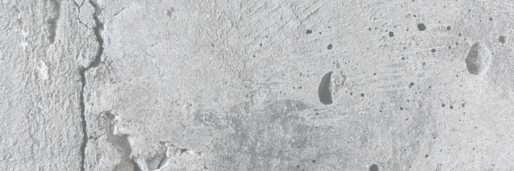 Texture of old cracked concrete wall. Rough gray concrete surface. Great for background and design. Close-up. High resolution.